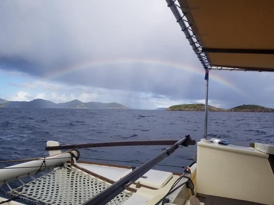 Full rainbow arc over the Virgin Islands seen from the Mahiya deck