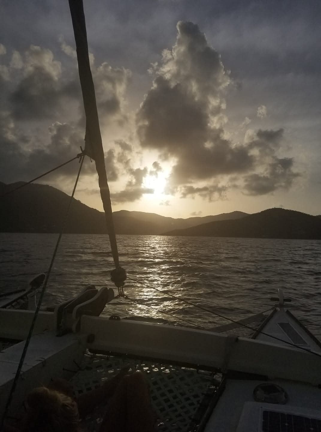 Moody golden sunset from the Mahiya bow with dramatic clouds and VI mountains silhouetted